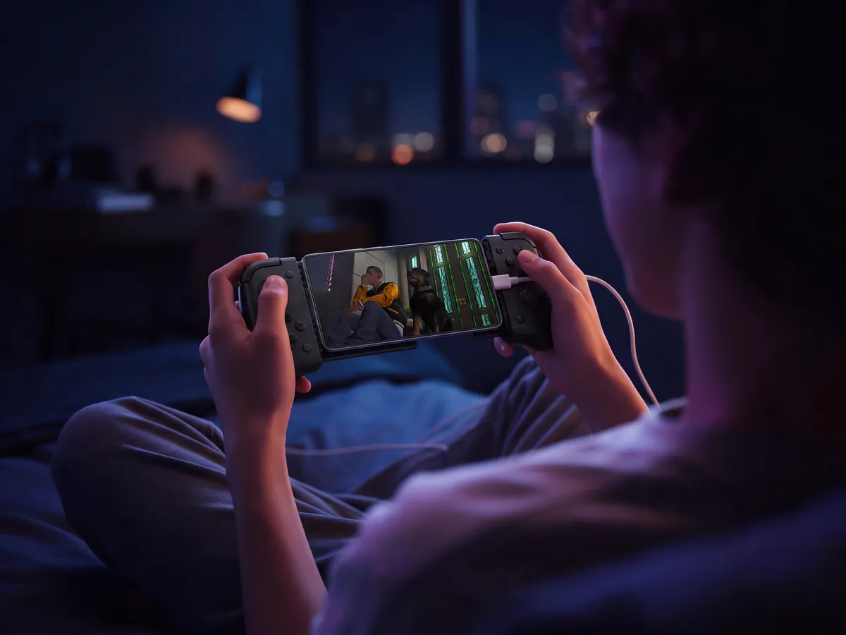 GTA V on an Android phone in a controller with a charging cable plugged in