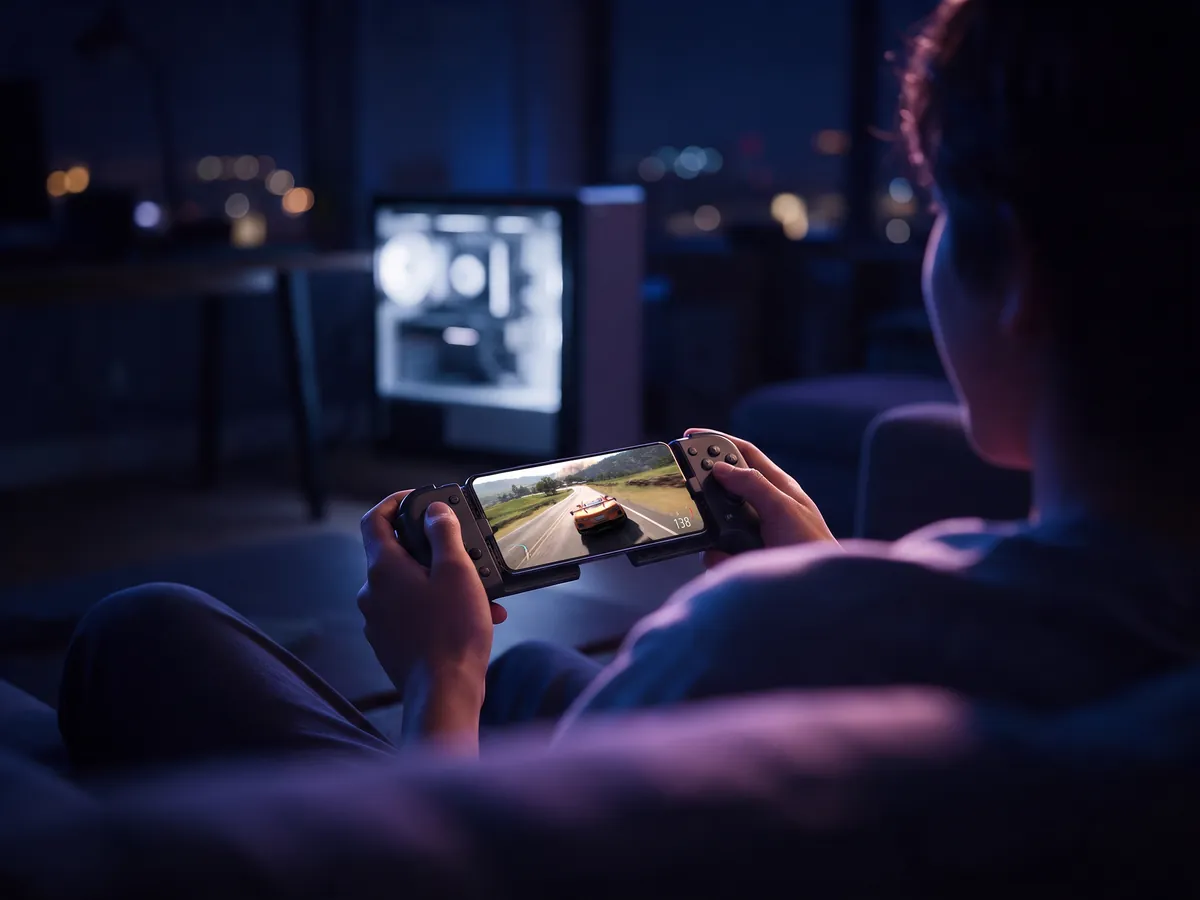 A racing game streamed from a gaming PC at home to an Android phone on the sofa