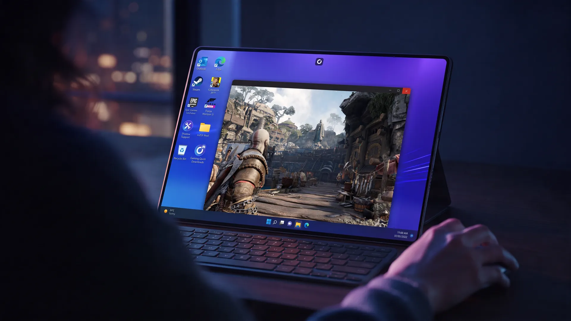 A Windows desktop with God of War on an iPad, with a keyboard and a mouse