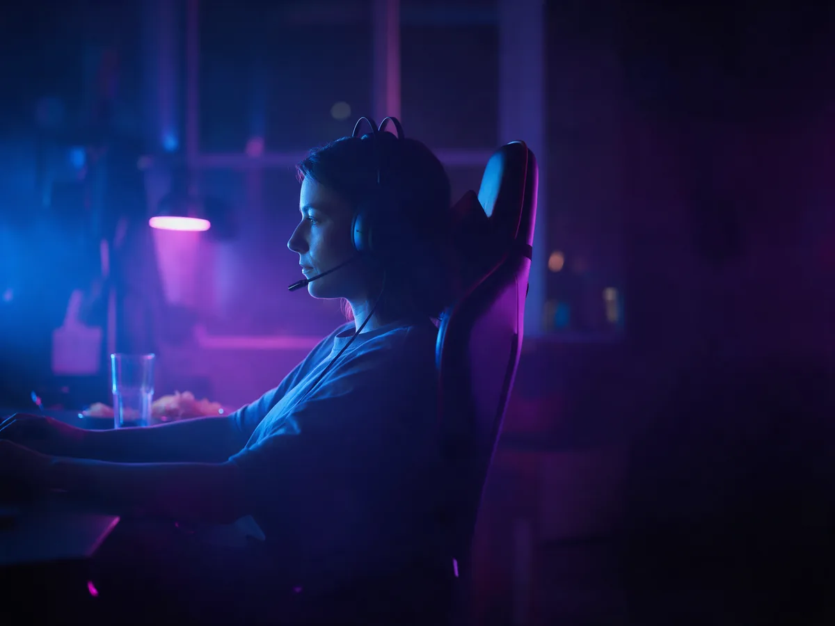 A player with a headset settled in for a long gaming session at night
